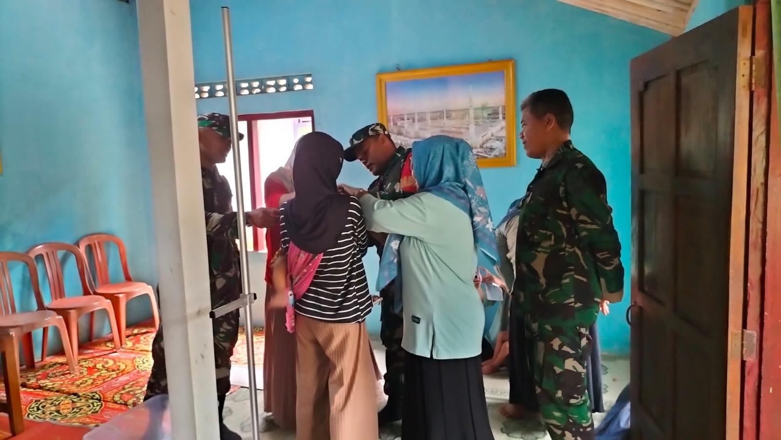 Danramil 11 Punggelan Dampingi Petugas Posyandu Wujudkan Balita Sehat